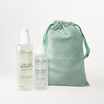 Glow Jar Beauty 3-In-1 and Healthy Scalp Serum bottles and a green drawstring bag on a white background
