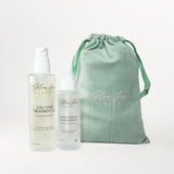 Glow Jar Beauty 3-In-1 and Healthy Scalp Serum bottles and a green drawstring bag on a white background