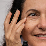 Woman applying Glow Jar Beauty Maracuja Eye Complex