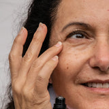 Woman applying Glow Jar Beauty Maracuja Eye Complex