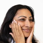 Glow Jar beauty woman rubbing in AHA Leave-On Exfoliant