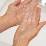 Hands with foaming gentle gel cleanser 