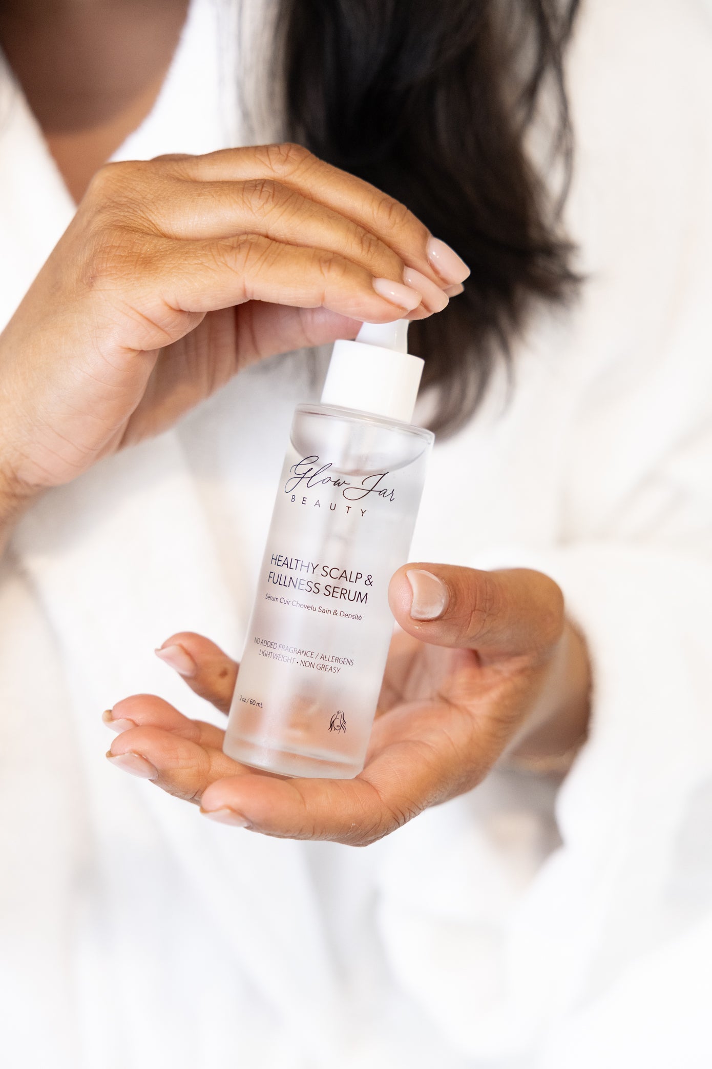 Glow Jar Beauty Scalp Serum bottle in hand